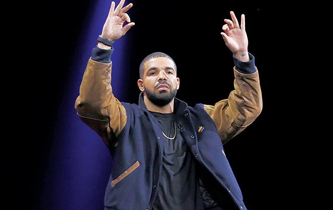Musician Drake gestures during the Apple Worldwide Developers Conference in San Francisco, Monday, June 8, 2015. The maker of iPods and iPhones introduced Apple Music, its new streaming-music service. (AP Photo/Jeff Chiu)