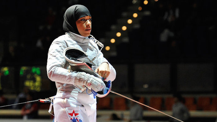 Ibtihaj Muhammad, of the United States, looks on prior to the start of a women's team sabre qualifying match at the World Fencing Championship in Catania, Italy, Saturday, Oct. 15, 2011. (AP Photo/Carmelo Imbesi)