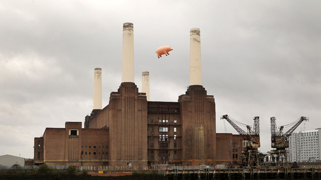LONDON, ENGLAND - SEPTEMBER 26:  An inflatable pig flies above Battersea Power Station in a recreation of Pink Floyd's 'Animals' album cover on September 26, 2011 in London, England. The classic Pink Floyd album artwork was recreated to mark the release of several digitally remastered versions of their albums.  (Photo by Oli Scarff/Getty Images)